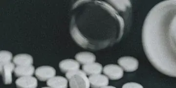 medications spilling from bottle