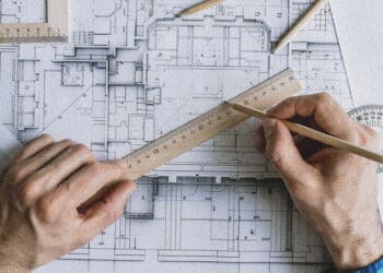 architect drawing on plans