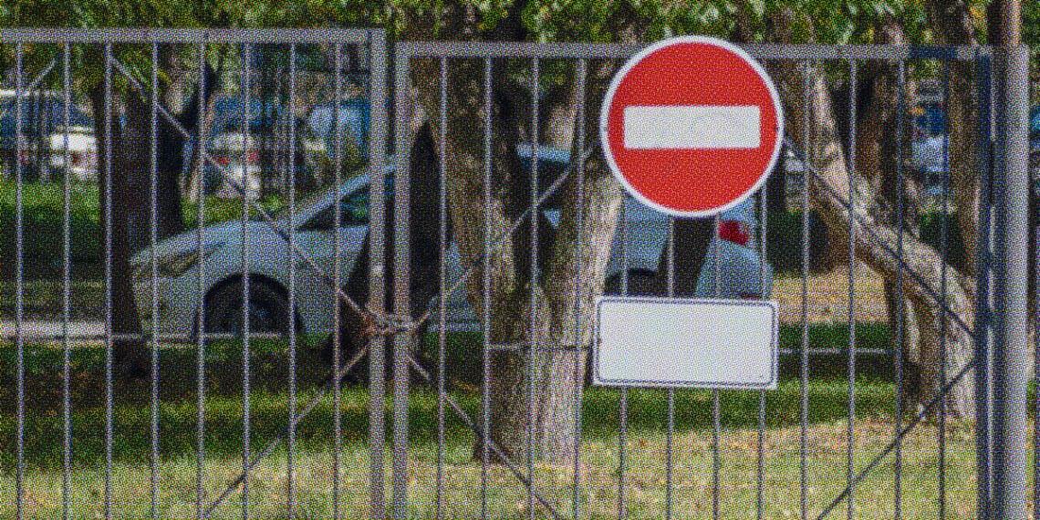 no entry sign on closed gate