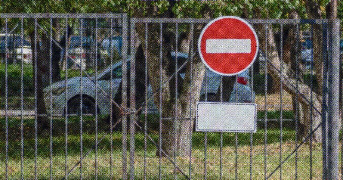 no entry sign on closed gate