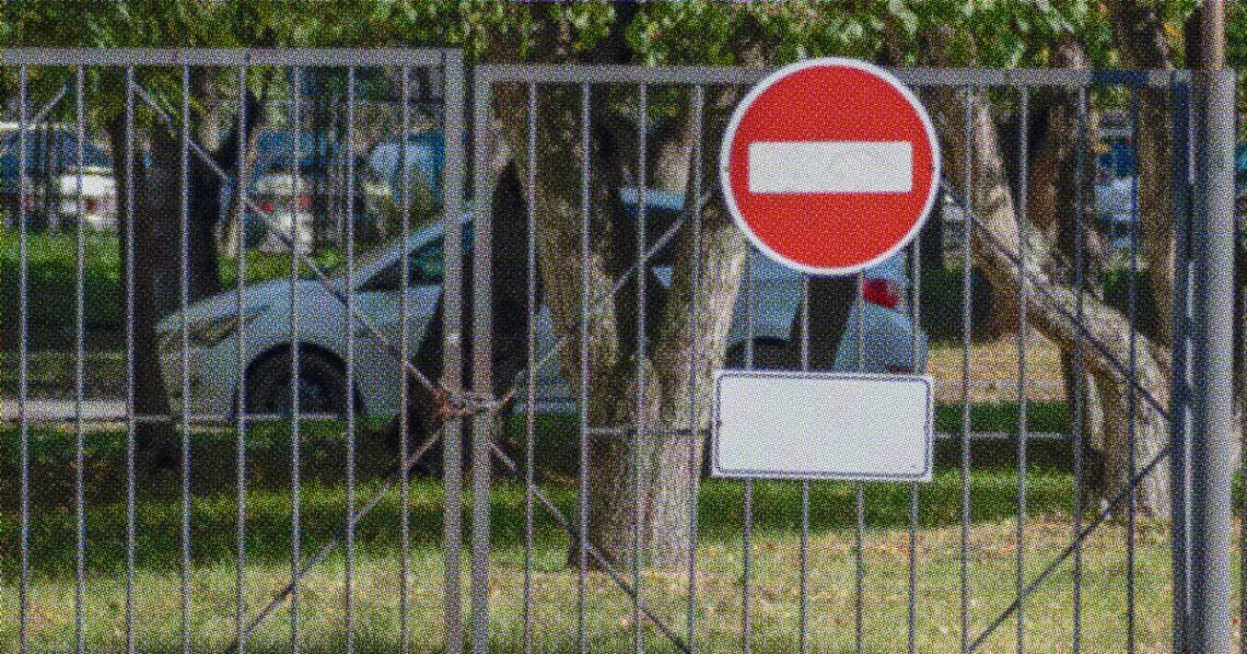 no entry sign on closed gate
