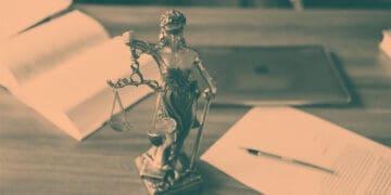 scales of justice statue on desk