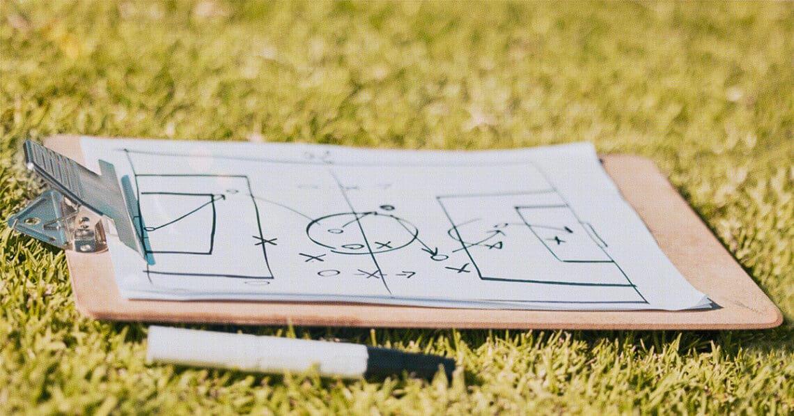 sports gameplan on clipboard