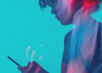teen looking at smartphone