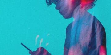 teen looking at smartphone