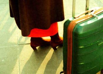 woman traveling for work with suitcase