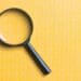 magnifying glass on yellow background