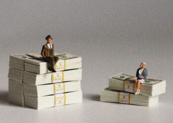 large bank small bank concept figurines and stacks of cash