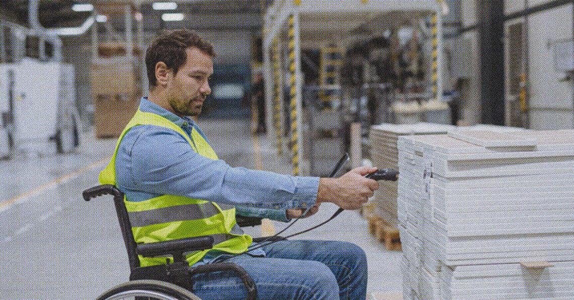 employee in wheelchair scanning bar codes