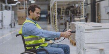 employee in wheelchair scanning bar codes
