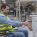 employee in wheelchair scanning bar codes