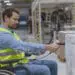 employee in wheelchair scanning bar codes