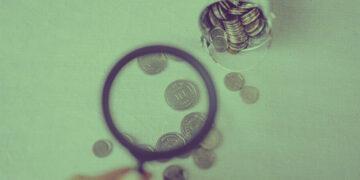 examining financial data with magnifying glass