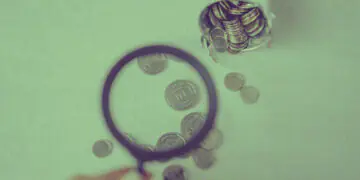 examining financial data with magnifying glass