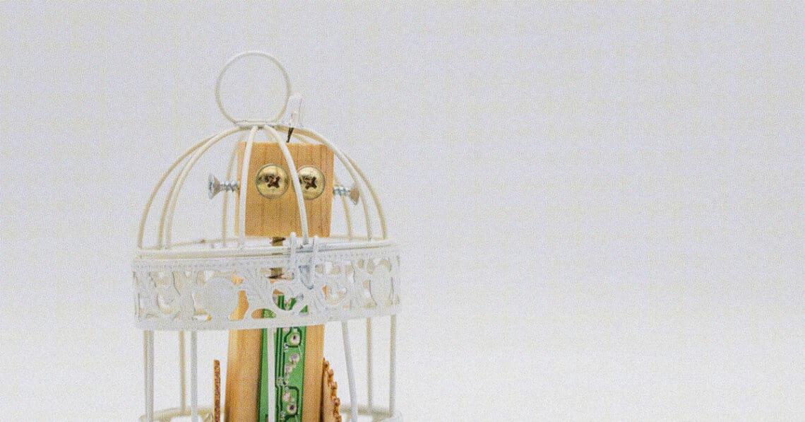 A robot locked in cage.