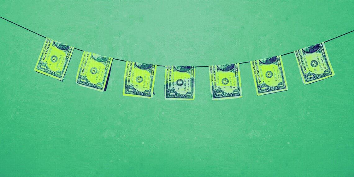 bills on clothesline money laundering concept