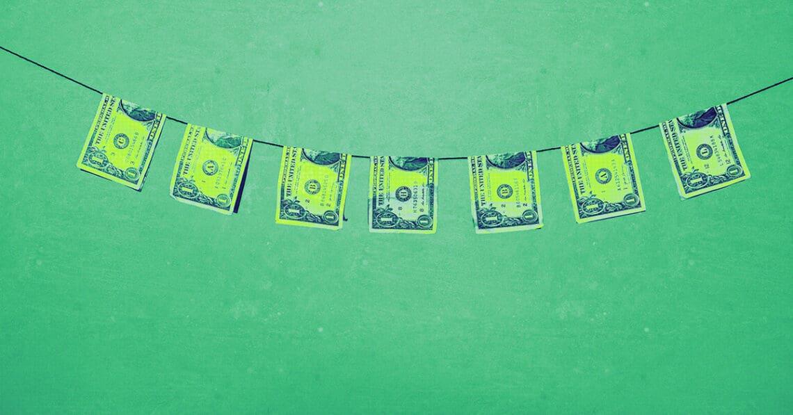 bills on clothesline money laundering concept