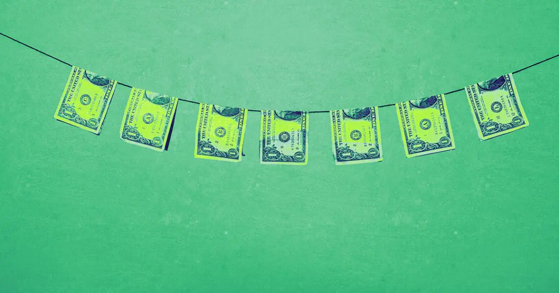 bills on clothesline money laundering concept
