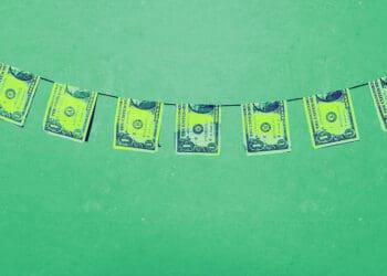 bills on clothesline money laundering concept