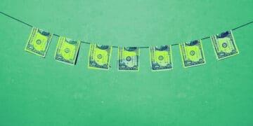 bills on clothesline money laundering concept