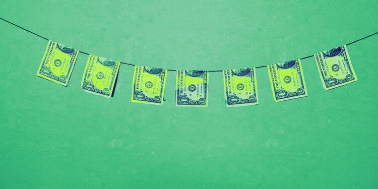 bills on clothesline money laundering concept