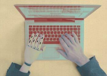 computer and human arms at laptop