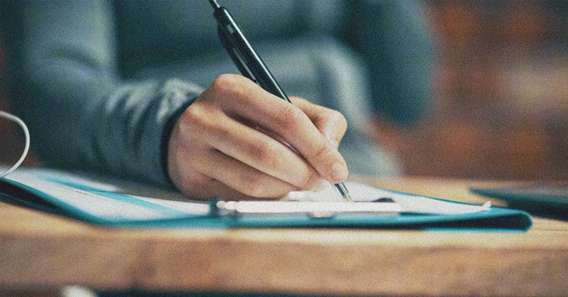 hand checking off checklist
