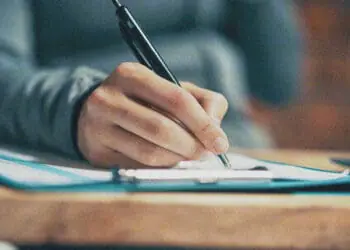 hand checking off checklist