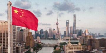 chinese flag flying over shanghai