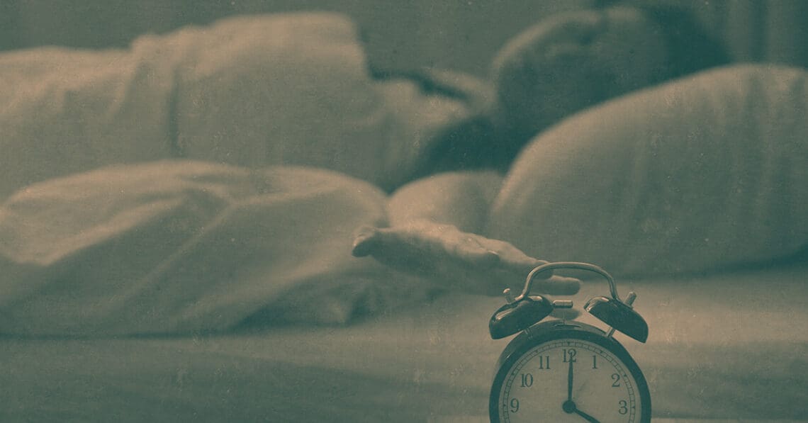 woman checking clock in middle of night