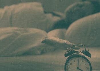woman checking clock in middle of night