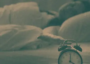 woman checking clock in middle of night