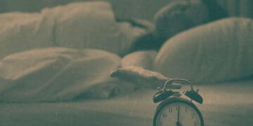 woman checking clock in middle of night