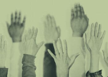 hands raised at meeting