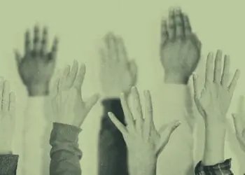 hands raised at meeting