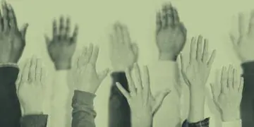hands raised at meeting
