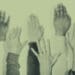 hands raised at meeting