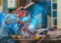 man welding in shop
