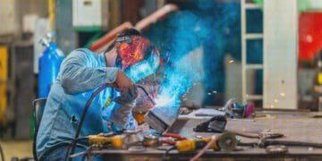 man welding in shop