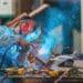 man welding in shop