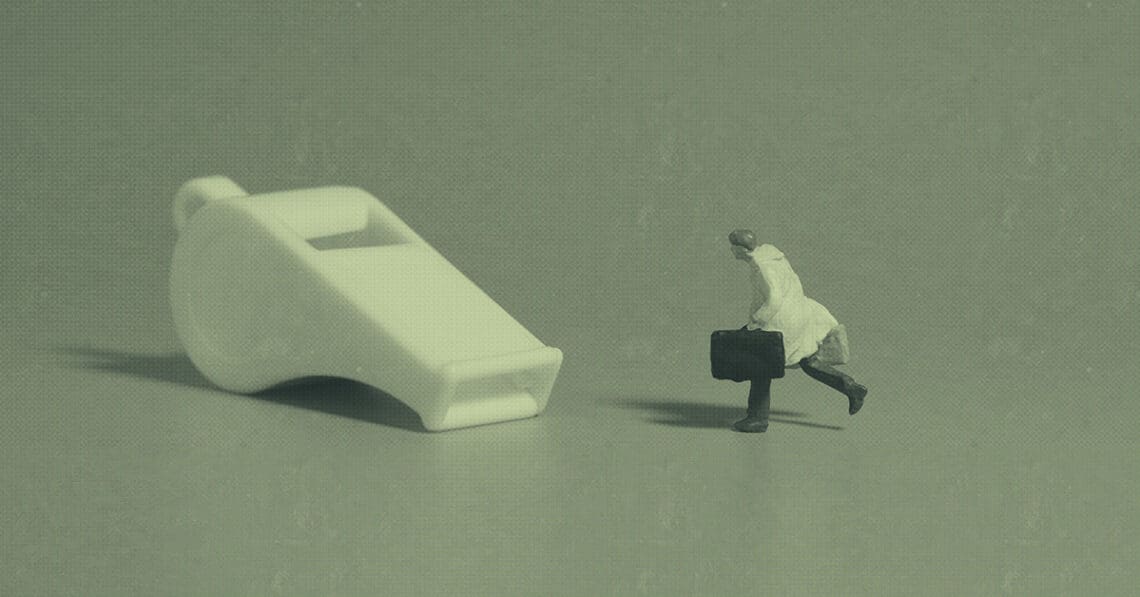 whistleblower concept figurine chasing whistle