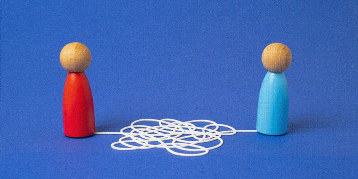 common language wooden block people string attached
