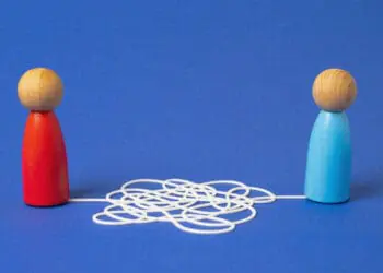 common language wooden block people string attached